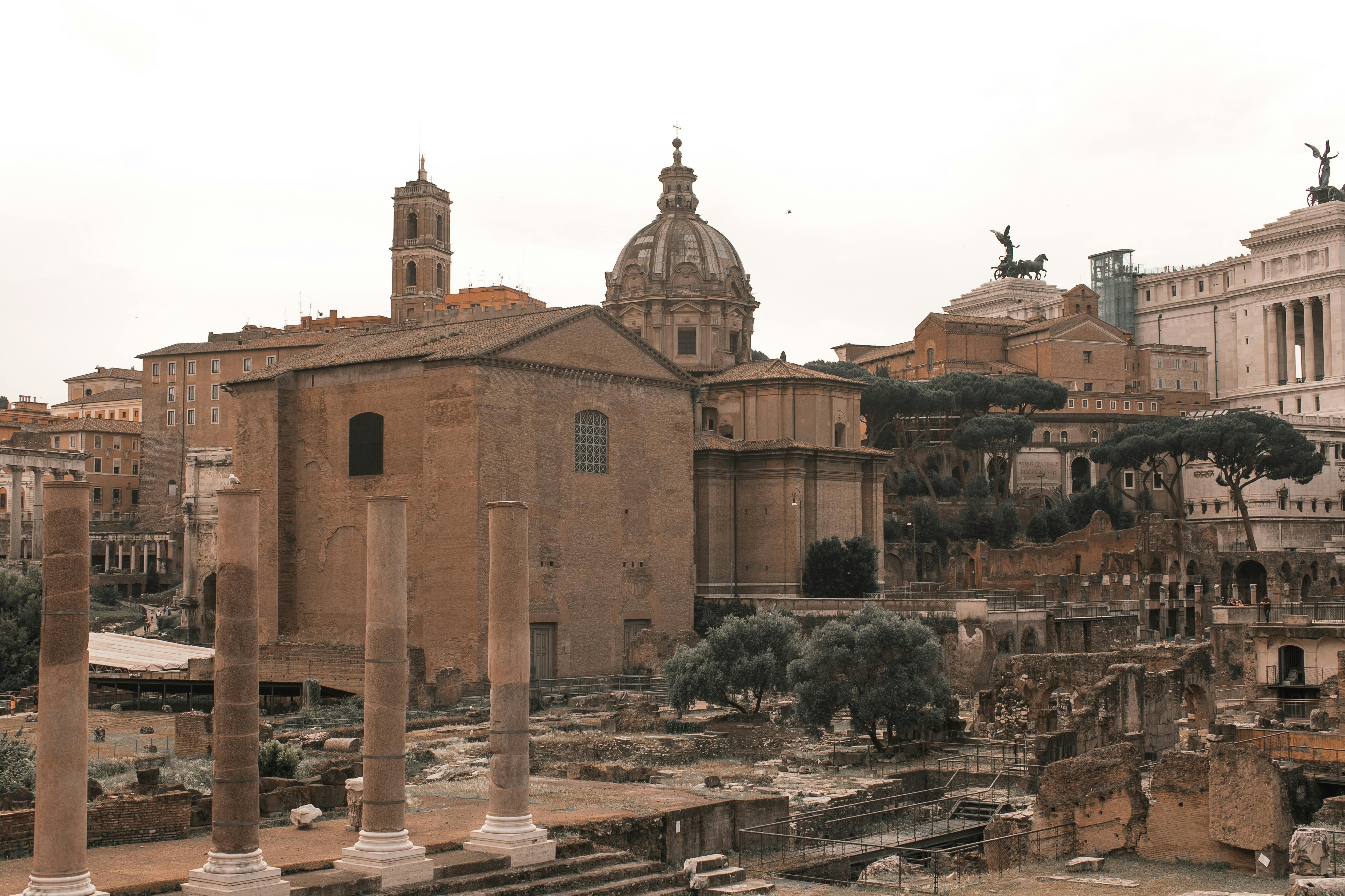 Entry to the Colosseum, Roman Forum, and Palatine Hill with Audioguide + Guided Tour of the Historic Center - Accommodations in Rome