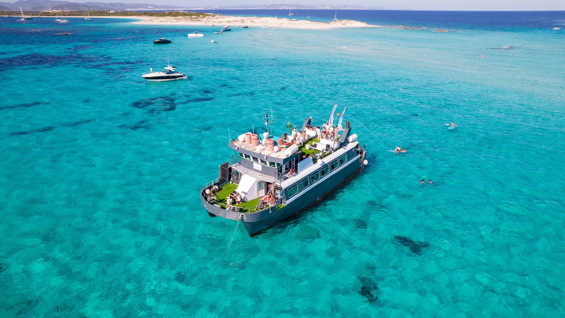 Boat trip to Illetas and Espalmador with breakfast, paella lunch and free time in Formentera