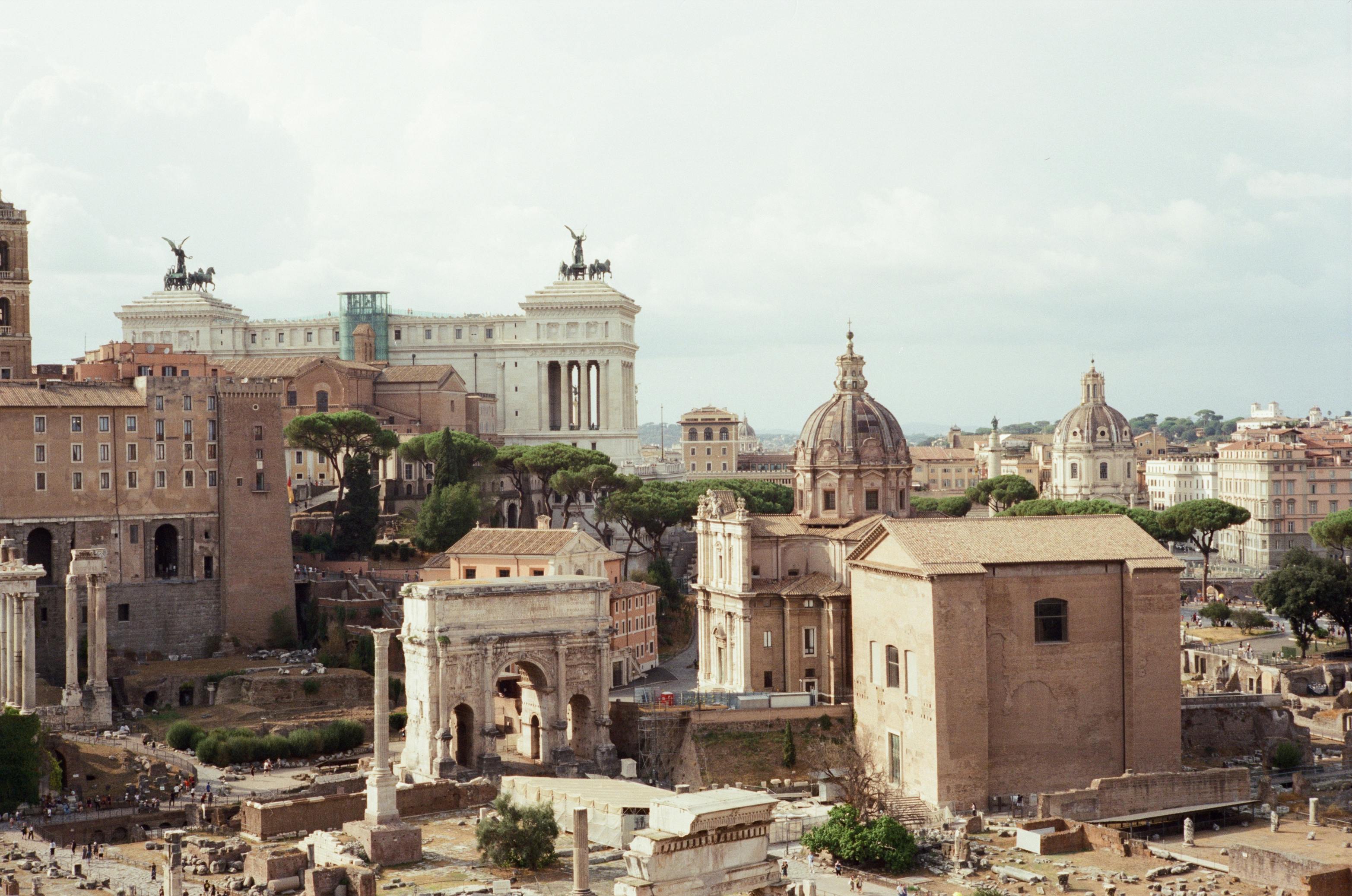 Entry to the Colosseum, Roman Forum, and Palatine Hill with Audioguide + Guided Tour of the Historic Center - Accommodations in Rome